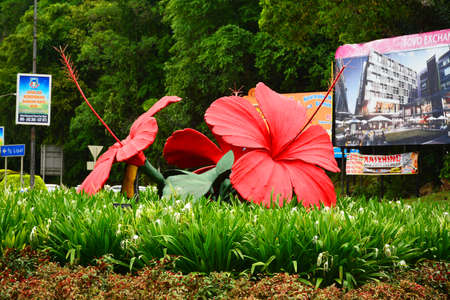 KOTA KINABALU, MY - JUNE 19: Bunga Raya monument on June 19, 2016 in Kota, Kinabalu, Malaysia. Hibiscus (Bunga Raya) is a flowering plant in the Hibisceae tribe of the family Malvaceae, native to East Asia.のeditorial素材