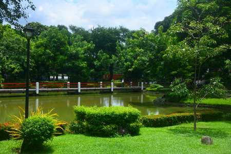 MANILA, PH - JULY 6: Bridge and lake at Japanese garden inside Rizal park on July 6, 2016 in Manila, Philippines.のeditorial素材