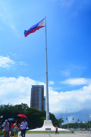 Manila, PH - JULY 6: National flag pole of the Philippines in Rizal Park on July 6, 2016. The...