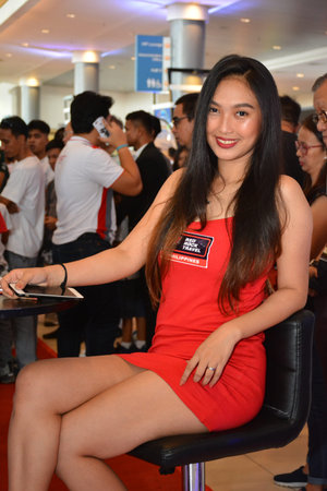 PASAY, PH - APRIL 7 - Red Rock Travel Philippines female model at Manila International Auto Show on April 7, 2019 in Pasay, Philippines.のeditorial素材