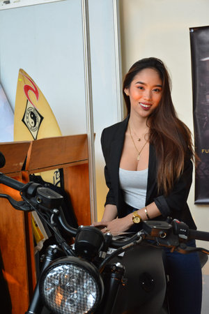 PASAY, PH - MARCH 24 - BMW motorrad motorcycle female model at Inside Racing Motor Bike Show on...