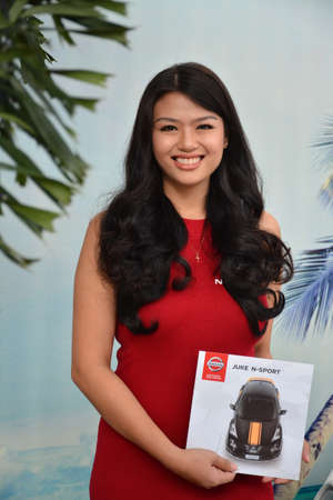 PASAY, PH - NOV 30 - Nissan female model at Manila Auto Salon car show on November 30, 2018 in Pasay, Philippines.のeditorial素材