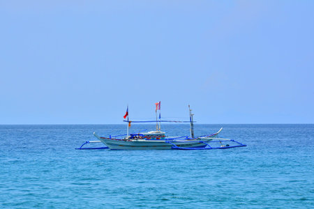 BATANGAS, PH - SEPT. 17: Fishing boat at Acuaverde Beach Resort on September 17, 2017 in Laiya,...