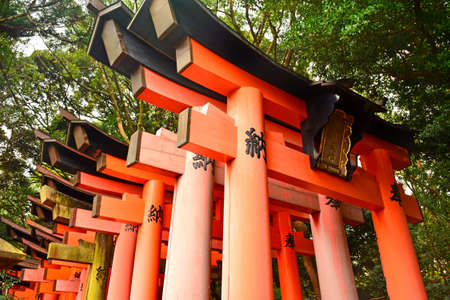 KYOTO, JP - APRIL 10 - Fushimi Inari Taisha shrine Japanese gate torii on April 10, 2017 in Kyoto, Japan. Fushimi Inari was dedicated to the gods of rice and sake by the Hata family in the 8th century.のeditorial素材