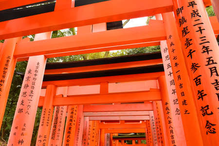 KYOTO, JP - APRIL 10 - Fushimi Inari Taisha shrine Japanese gate torii on April 10, 2017 in Kyoto, Japan. Fushimi Inari was dedicated to the gods of rice and sake by the Hata family in the 8th century.のeditorial素材