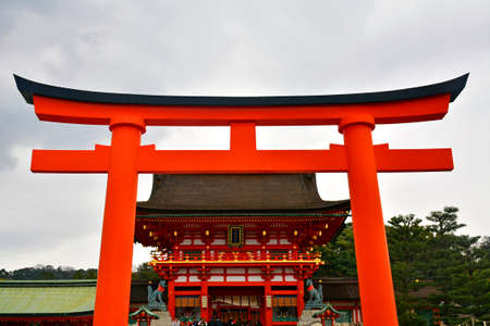KYOTO, JP - APRIL 10 - Fushimi Inari Taisha shrine Japanese gate torii on April 10, 2017 in Kyoto, Japan. Fushimi Inari was dedicated to the gods of rice and sake by the Hata family in the 8th century.のeditorial素材