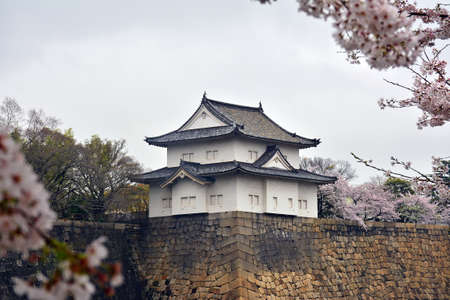 OSAKA, JP - APRIL 8 - Osaka Castle turret and wall on April 8, 2017 in Osaka, Japan. Osaka Castle is one of the most famous landmarks and it played a role in the unification of Japan during 16th century.のeditorial素材