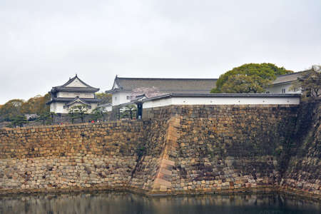 OSAKA, JP - APRIL 8 - Osaka Castle turret and wall on April 8, 2017 in Osaka, Japan. Osaka Castle is one of the most famous landmarks and it played a role in the unification of Japan during 16th century.のeditorial素材