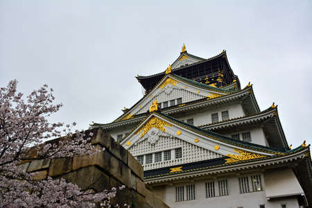 OSAKA, JP - APRIL 8 - Osaka Castle facade on April 8, 2017 in Osaka, Japan. Osaka Castle is one of the most famous landmarks and it played a role in the unification of Japan during 16th century.のeditorial素材