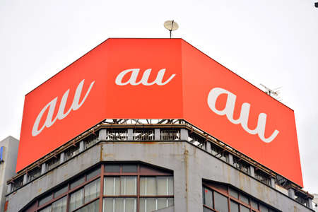 OSAKA, JP - APRIL 9 - Au cell phone store facade and sign on April 9, 2017 in Osaka, Japan.のeditorial素材
