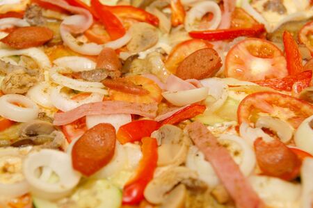 Pepperoni with meat, sausage, and vegetable toppings Italian pizza pieの写真素材