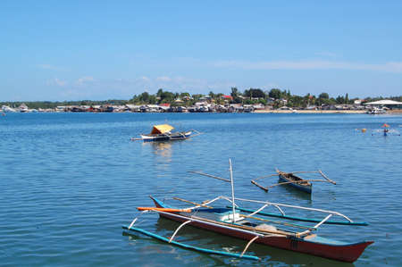 PALAWAN, PH - DEC 1 - Fishing boats at Puerto Princesa city baywalk park on December 1, 2009 in Palawan, Philippines.のeditorial素材