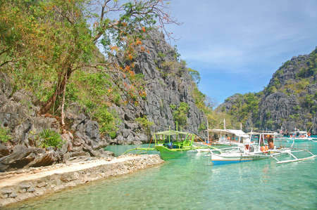 PALAWAN, PH - MARCH 7 - Kayangan lake limestone rock formation and boats on March 7, 2012 in Coron, Palawan, Philippines.のeditorial素材