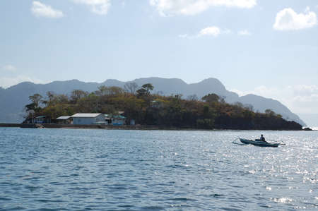 PALAWAN, PH - MARCH 8 - Island with houses and trees on March 8, 2012 in Coron, Palawan, Philippines.のeditorial素材