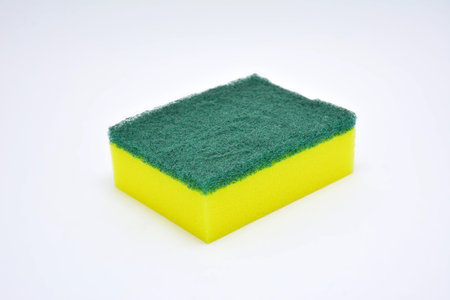 Sponge plus scrubber in yellow and green color use for cleaning plates and bowls