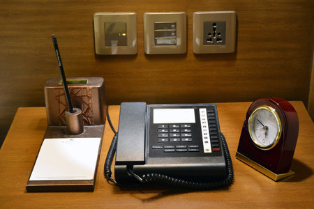 PASIG, PH - JAN 19 - Marco Polo hotel phone, alarm clock, and lamp on desk on January 19, 2019 in...