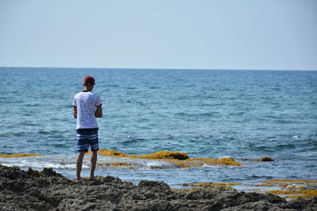 Beach sea water waves and sand shore in the Philippinesの写真素材