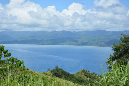 Rock formation and sea water at mountain view white beach resort in Dingalan, Aurora, Philippines