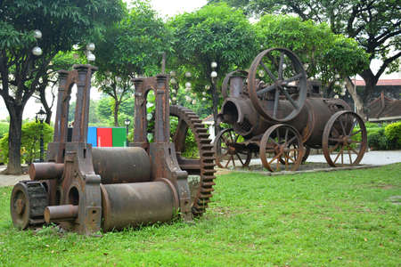 MANILA, PH - OCT. 5 - Baluarte De San Diego rusty locomotive train and parts display at Intramuros walled city on October 5, 2019 in Manila, Philippines.のeditorial素材