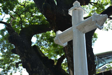 MANILA, PH - OCT 20 - Paco Park memorial cross marker on October 20, 2018 in Manila, Philippines. Paco Park is a recreational garden and was once a cemetery during Spanish periodのeditorial素材