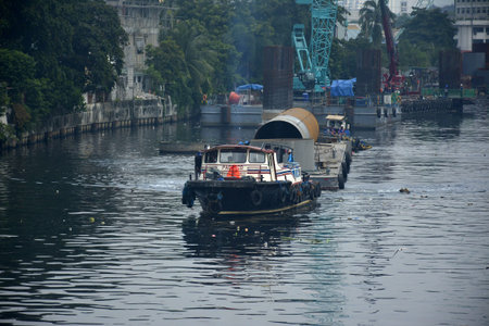 MANDALUYONG, PH - OCT 6 - Tugboat at Pasig river on October 6, 2018 in Mandaluyong, Philippines.