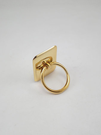 Smart phone ring stand gold color use to insert fingers while holding the phone