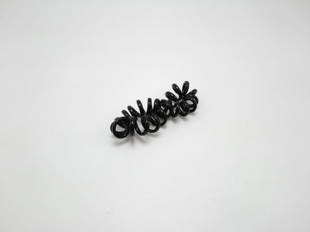 Black plastic spiral head band use to tie hair of a girl