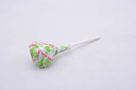 MANILA, PH - JULY 9 - Dum dum lollipop candy sour apple flavor on July 9, 2021 in Manila, Philippines.のeditorial素材