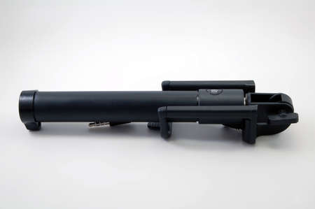 Black selfie stick with shutter button use to shoot photos using smartphoneの写真素材