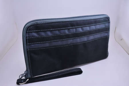 Black check book pouch with handle use to put checks and cash money insideの写真素材