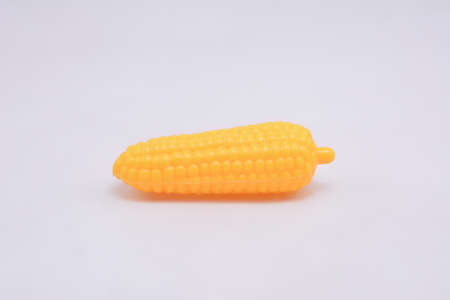 Yellow corn plastic toy played by kidsの写真素材