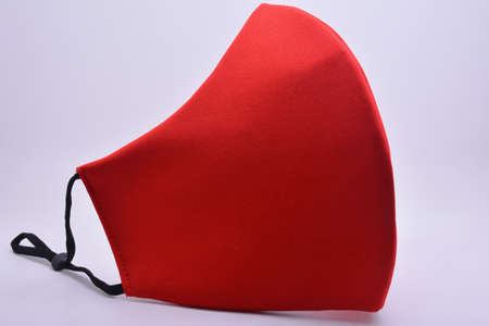 Red washable face mask wear use to cover mouth against virus for adultsの写真素材