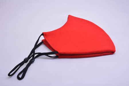 Red washable face mask wear use to cover mouth against virus for adultsの写真素材