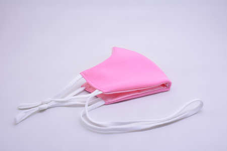 Pink washable face mask wear use to cover mouth against virus for kidsの写真素材