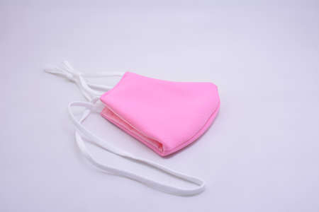 Pink washable face mask wear use to cover mouth against virus for kidsの写真素材