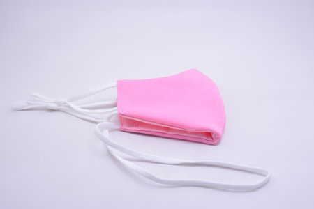 Pink washable face mask wear use to cover mouth against virus for kidsの写真素材
