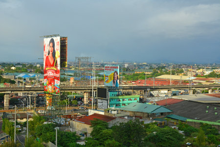 QUEZON CITY, PH - NOV 27 - City overview with buildings and roads on November 27, 2021 in Quezon City, Philippines. Quezon City is located on the Guadalupe Plateau, just northeast of Manila, in the Philippines.のeditorial素材