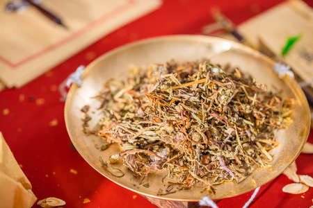 Sun-dried dandelion with ancient Chinese herbal medicineの写真素材