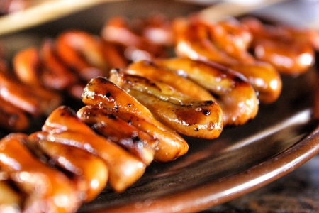 Isaw is a street food from the Philippines made from barbecued chicken intestine.の素材