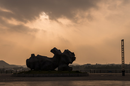 Lion shape sculpture in the city parkの写真素材