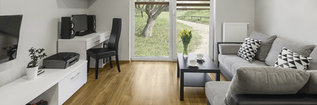 Panoramic view of modern designed grey living roomの写真素材