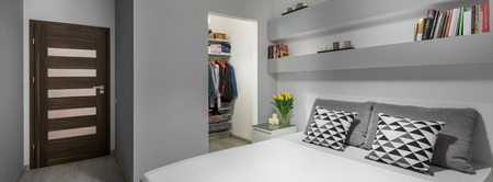 Double bed and big wardrobe in modern bedroom,panoramaの写真素材