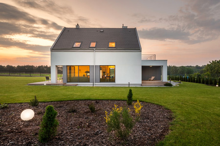 Photo of elegant white villa with backyardの写真素材