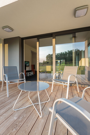 Luxurious house with new patio, simple patio furniture setの写真素材