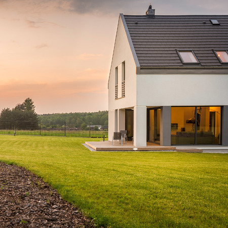 New design white villa with wide, perfect lawn,external viewの写真素材