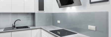 Panorama of kitchen interior in modern style with white furnitureの写真素材
