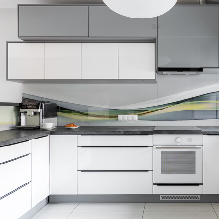 Light modern kitchen interior with white and grey furnitureの写真素材