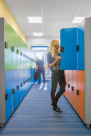 Modern style university interior with colorful lockers in hallwayの写真素材
