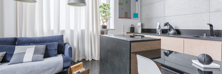 Functional loft interior with kitchen and living room, panoramaの写真素材