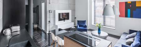Modern and bright home interior with open floor plan, panoramaの写真素材